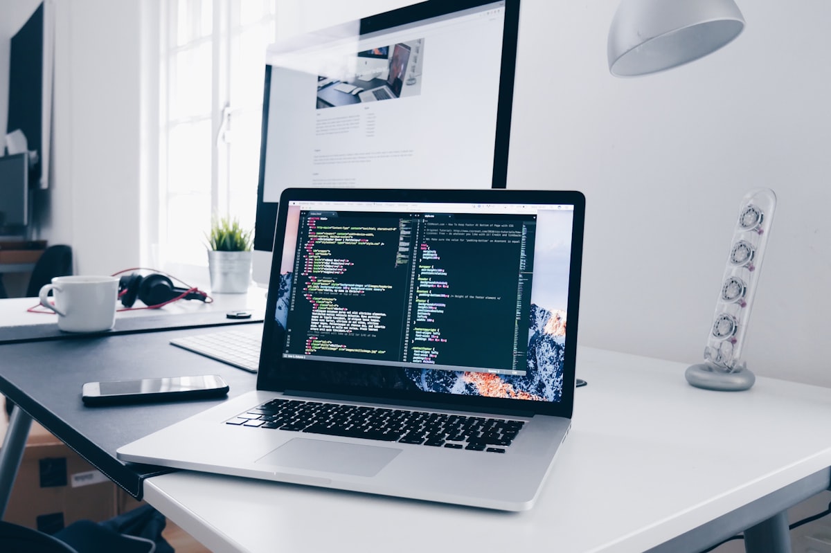 Premium technology workspace with multiple development monitors